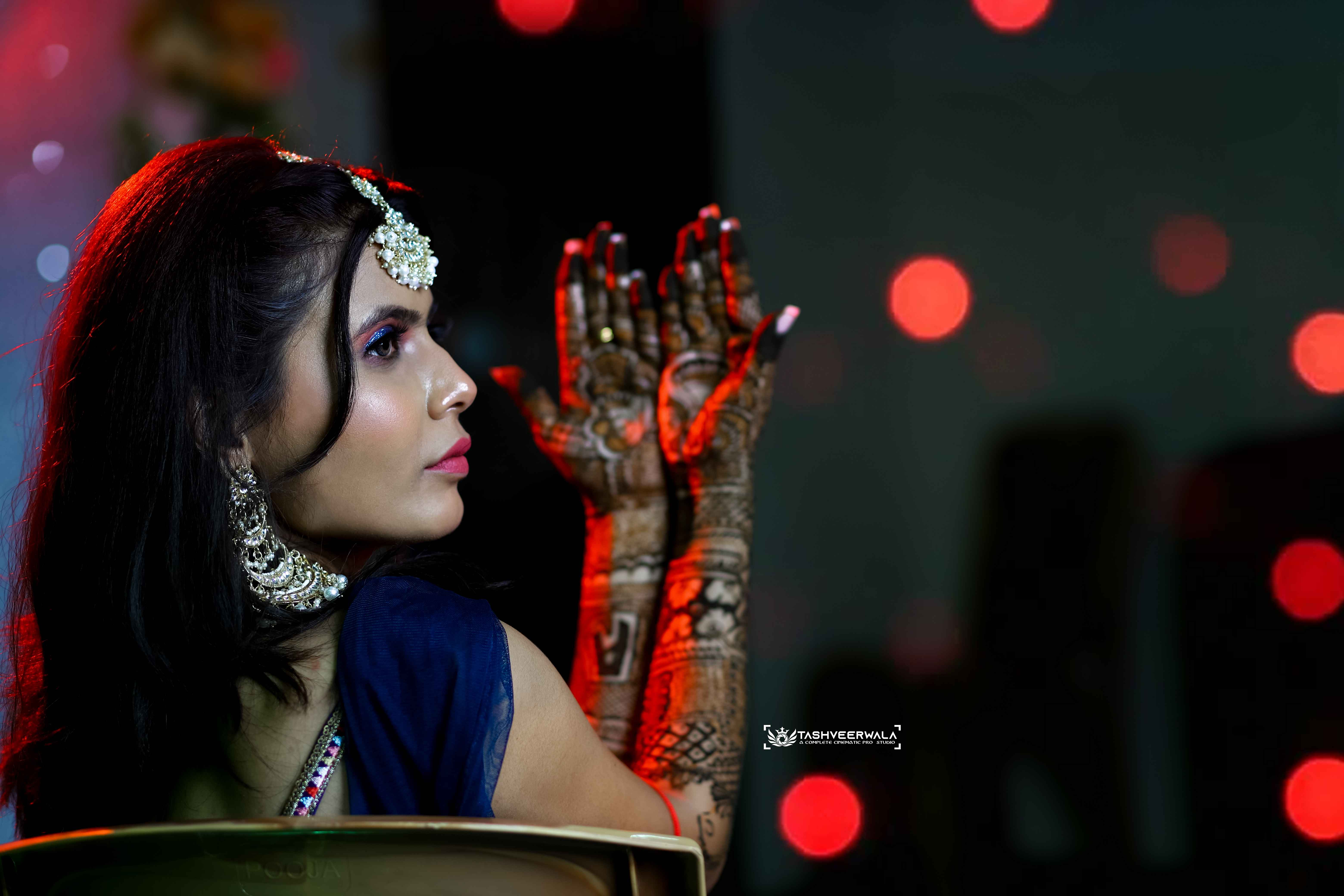 Artistic bridal portrait showcasing intricate henna designs