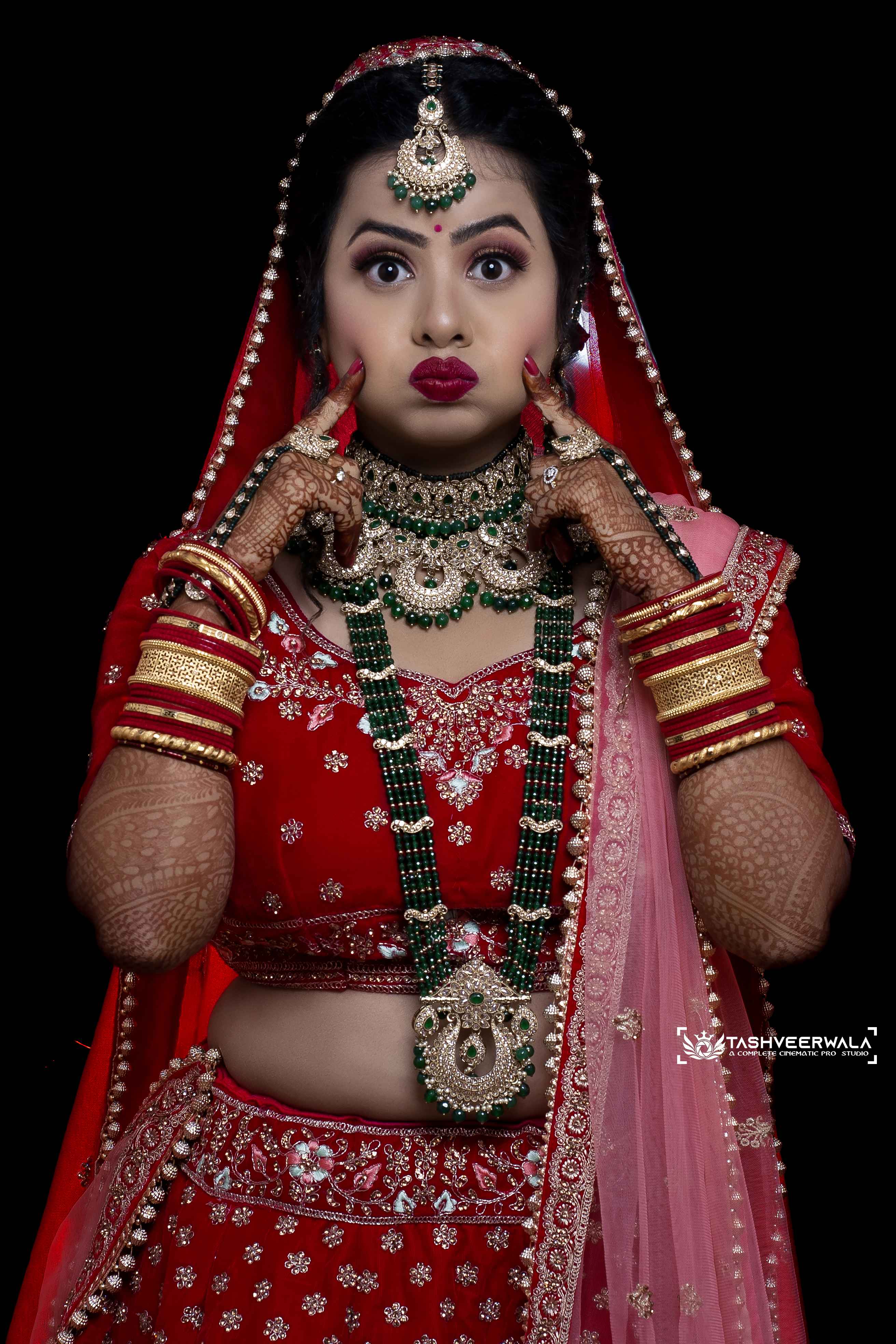 Stunning bridal portrait in full traditional red wedding attire